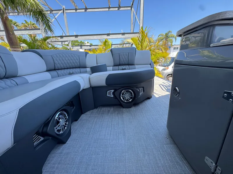 Slide: The Image of Luxurious seating area on 2025 Avalon Excalibur 27' boat with modern design and speakers. - 39