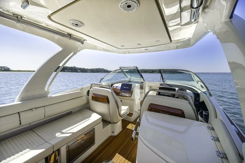 Slide: The Image of 2022 Chris-Craft Launch 31 GT boat interior with luxurious seating and modern dashboard. - 4