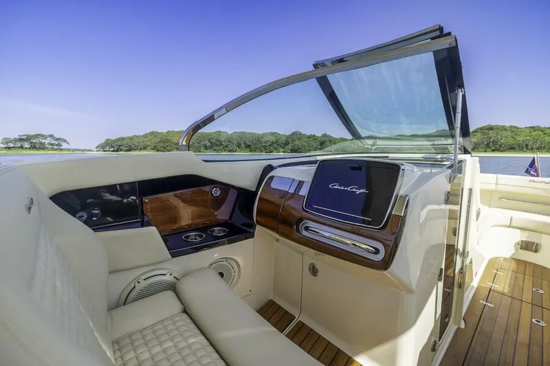 Slide: The Image of 2022 Chris-Craft Launch 31 GT interior with luxurious seating and sleek dashboard design. - 9
