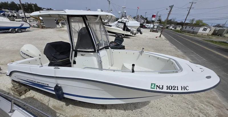 Slide: The Image of 2009 Hydra-Sports Vector 2200 CC boat on display in a marina setting. - 1