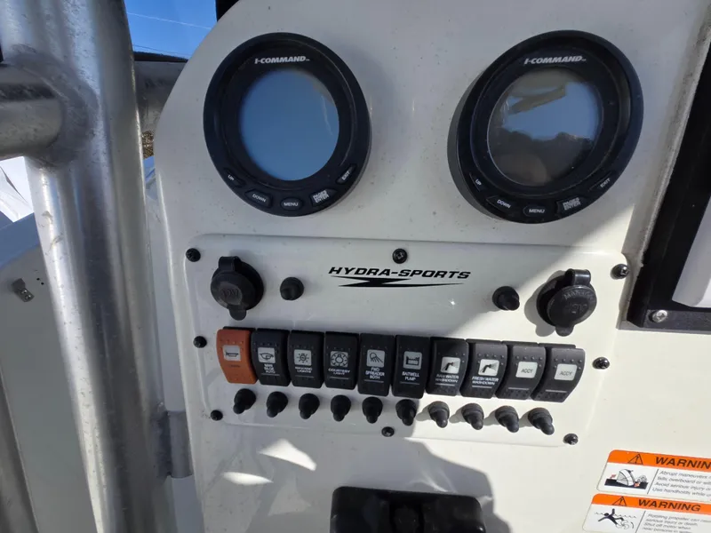 Slide: The Image of Control panel of a 2009 Hydra-Sports Vector 2200 CC boat with gauges and switches. - 10