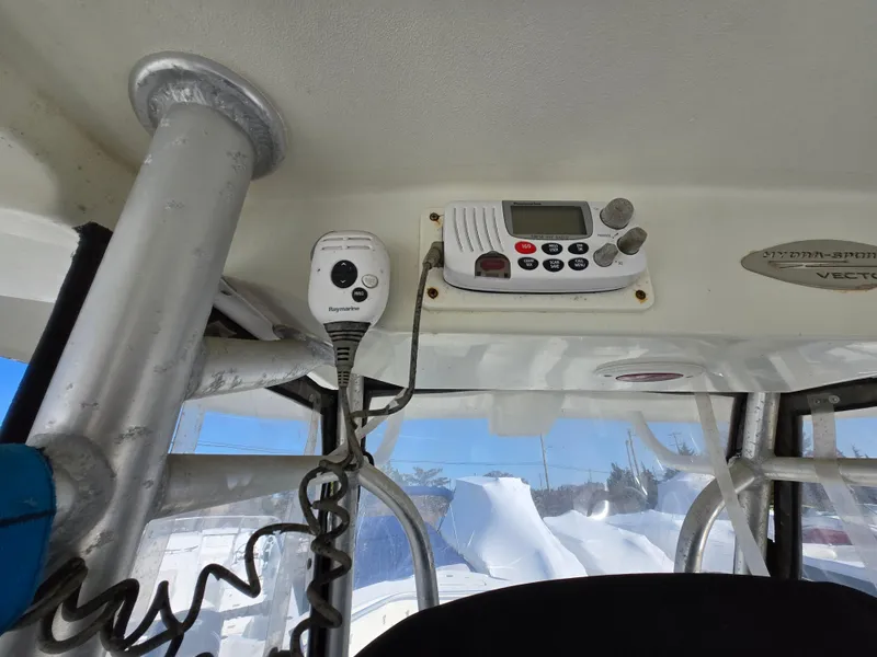 Slide: The Image of 2009 Hydra-Sports Vector 2200 CC boat interior with radio equipment and controls. - 17