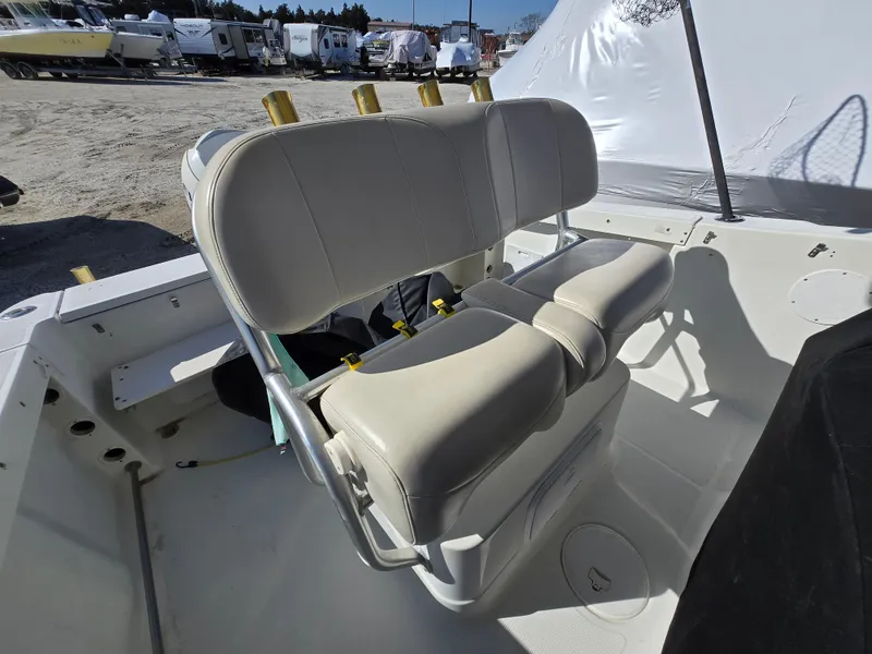 Slide: The Image of 2009 Hydra-Sports Vector 2200 CC boat interior with cushioned seating and rod holders. - 20