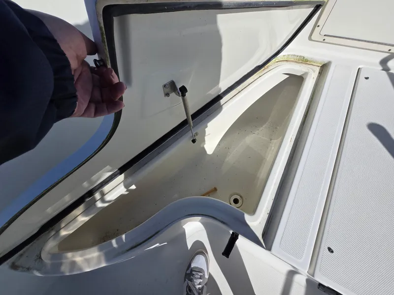 Slide: The Image of 2009 Hydra-Sports Vector 2200 CC boat storage compartment open, showing interior space. - 5