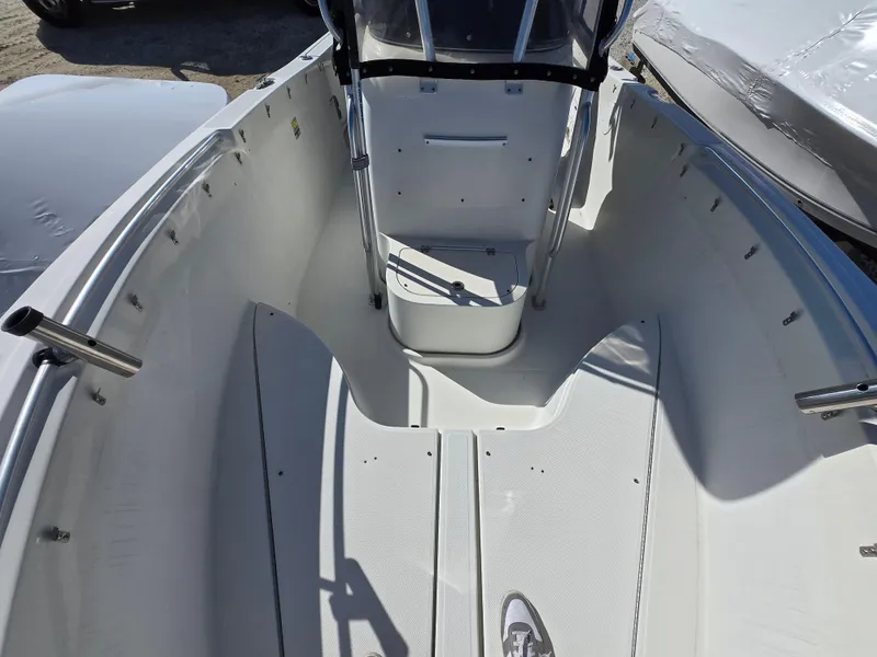 Slide: The Image of 2009 Hydra-Sports Vector 2200 CC boat interior, featuring spacious deck and center console. - 7