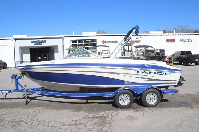 Slide: The Image of 2007 Tahoe Q6 Sport boat on trailer, parked outside dealership. - 4