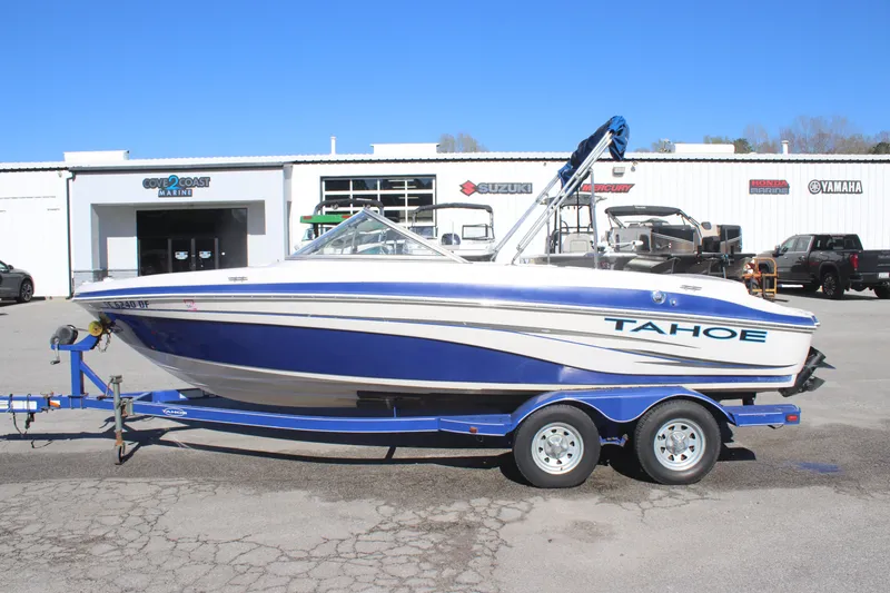 Slide: The Image of 2007 Tahoe Q6 Sport boat on trailer, parked outside dealership. - 5