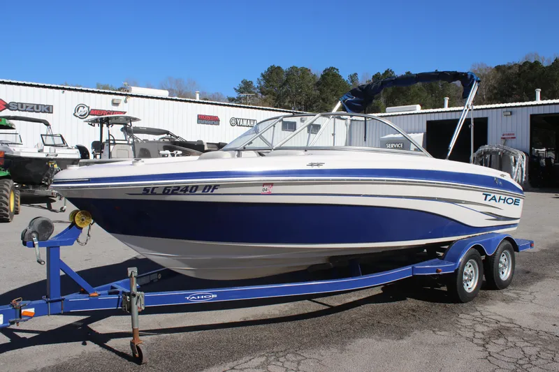 Slide: The Image of 2007 Tahoe Q6 Sport boat on trailer, parked outdoors near dealership. - 6
