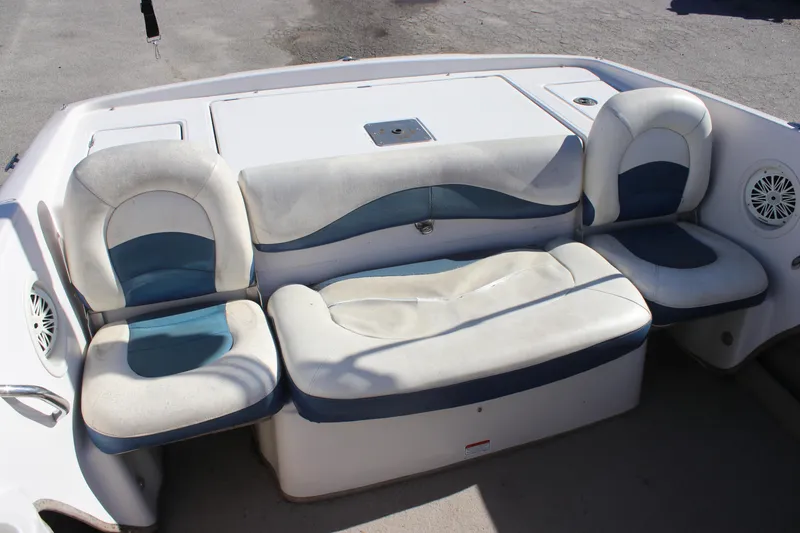 Slide: The Image of 2007 Tahoe Q6 Sport boat interior with cushioned seating and built-in speakers. - 7