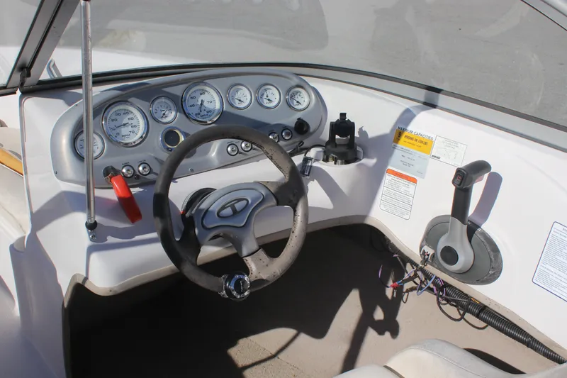 Slide: The Image of 2007 Tahoe Q6 Sport boat dashboard with steering wheel and instrument panel. - 8