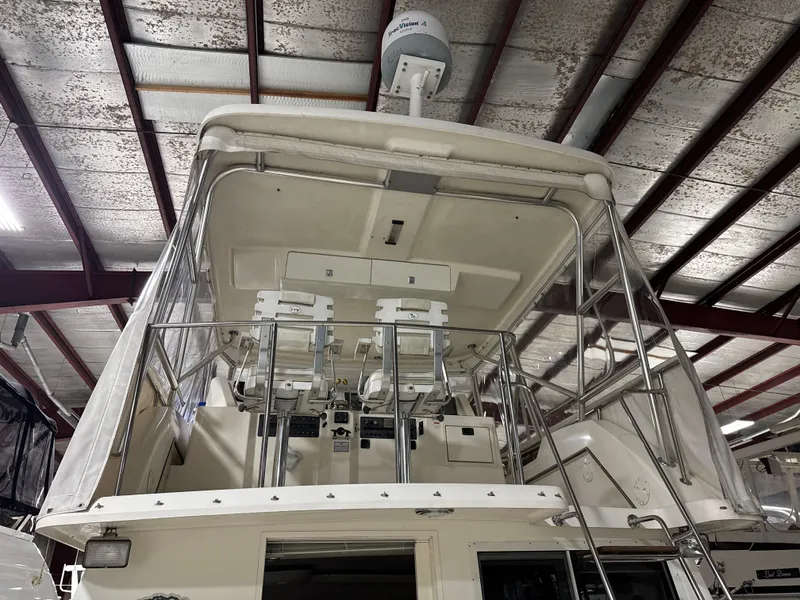 Slide: The Image of 1990 Tiara Yachts 4300 Convertible, upper deck view in storage facility. - 12