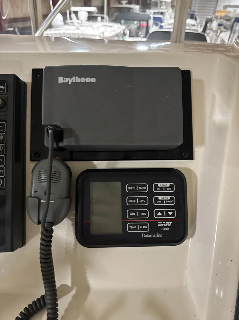 Slide: The Image of Control panel of a 1990 Tiara Yachts 4300 Convertible with Raytheon and Datamarine equipment. - 18