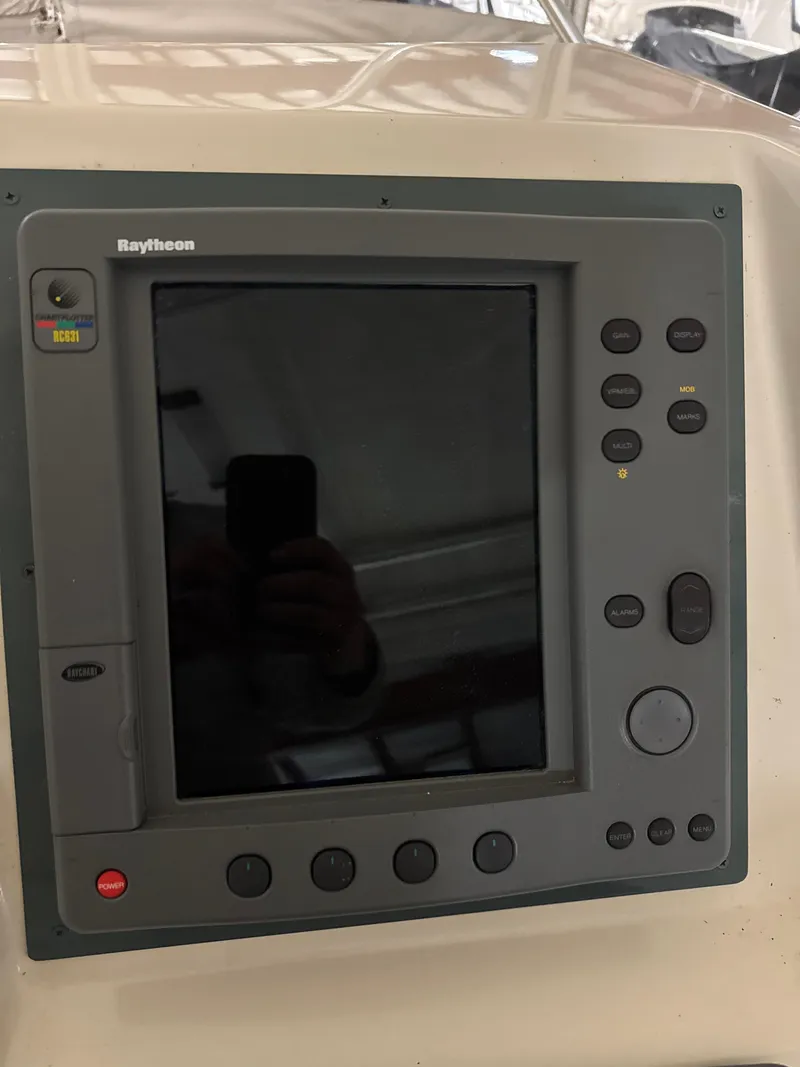 Slide: The Image of Raytheon marine navigation system on 1990 Tiara Yachts 4300 Convertible. - 21