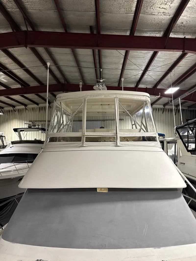 Slide: The Image of 1990 Tiara Yachts 4300 Convertible in indoor storage, front view. - 26