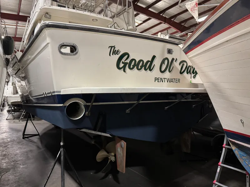 Slide: The Image of 1990 Tiara Yachts 4300 Convertible in storage, named "The Good Ol' Days," Pentwater. - 31
