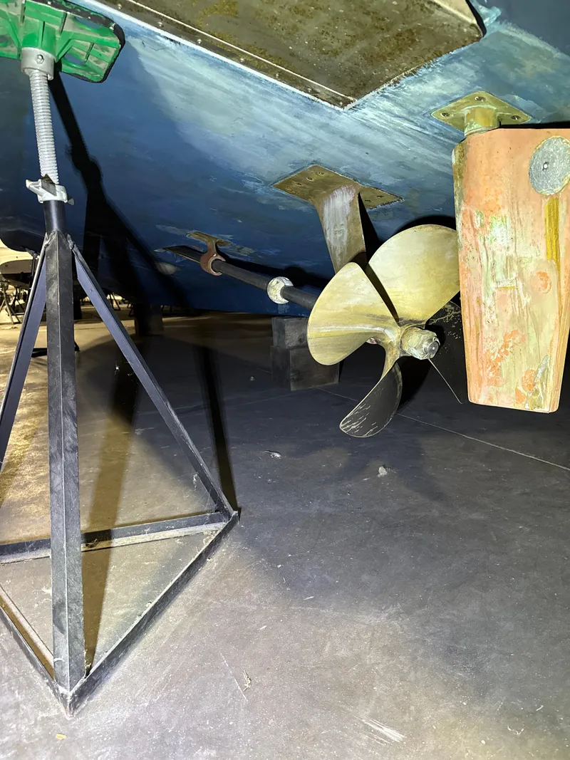 Slide: The Image of Underwater view of 1990 Tiara Yachts 4300 Convertible propeller and rudder. - 32