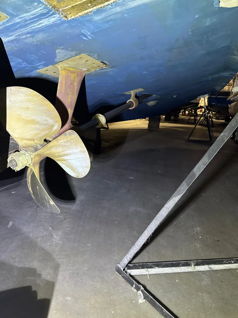 Slide: The Image of 1990 Tiara Yachts 4300 Convertible propeller and hull in dry dock. - 33