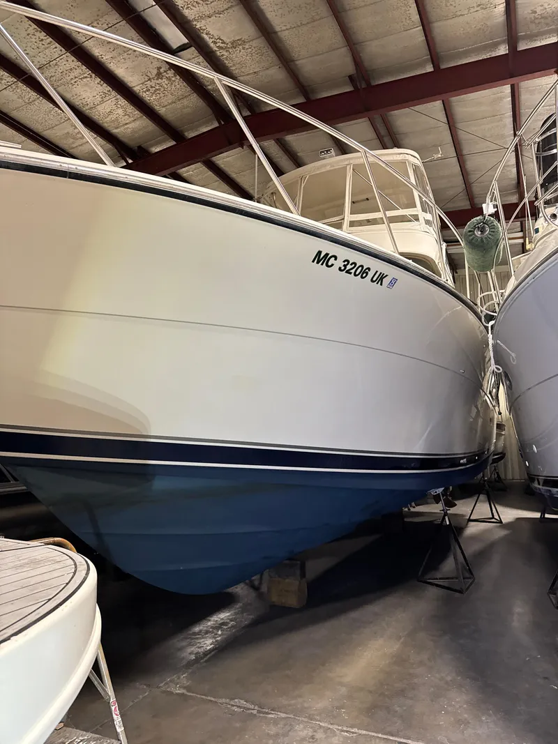 Slide: The Image of 1990 Tiara Yachts 4300 Convertible in storage, showcasing sleek design and sturdy build. - 34