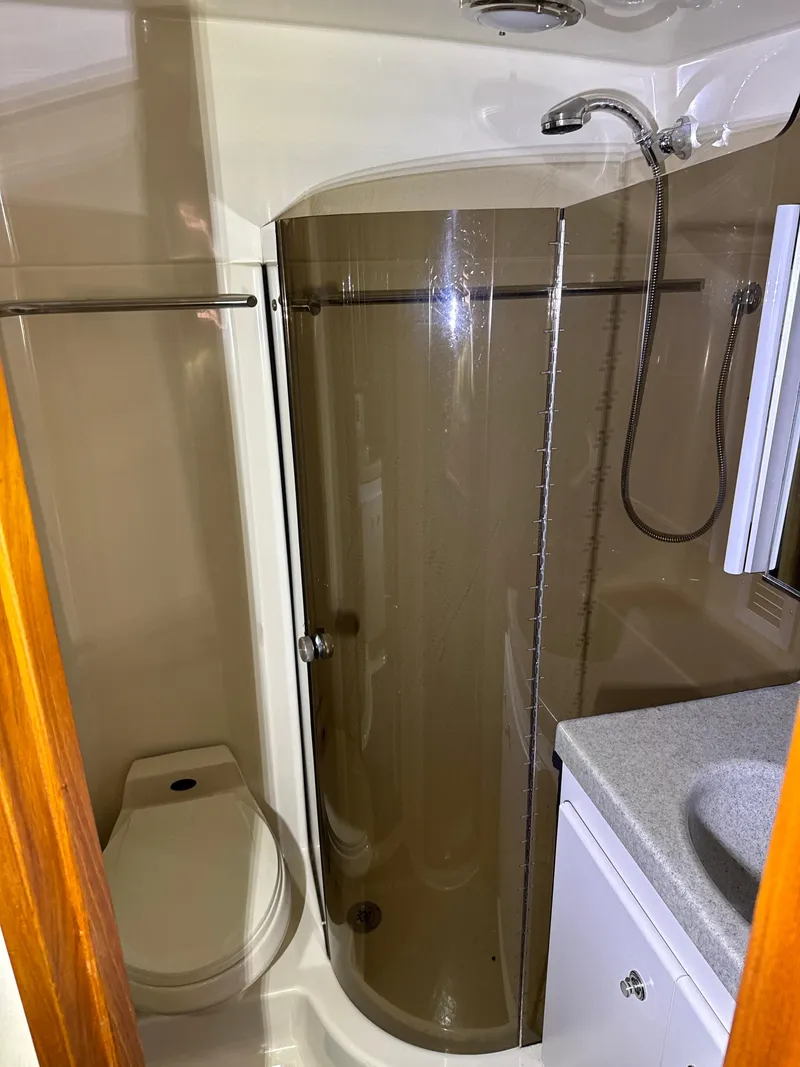 Slide: The Image of Bathroom interior of 1990 Tiara Yachts 4300 Convertible with shower and toilet. - 46