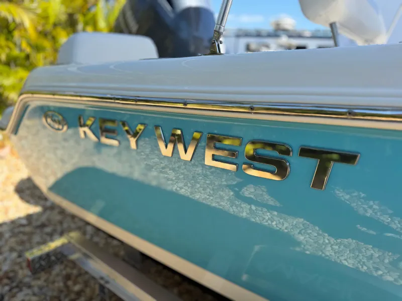 Slide: The Image of 2022 Key West 189 FS boat, close-up of logo on blue hull. - 6