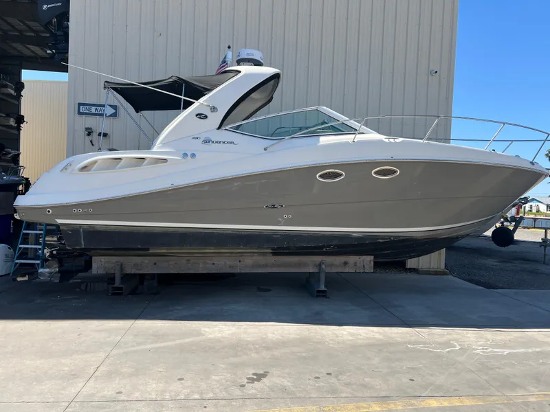 The Image of 2006 Sea Ray 290 Sundancer boat on dry dock, side view. - 0