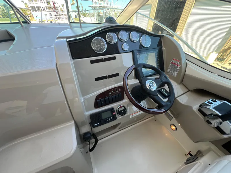 Slide: The Image of Helm of 2006 Sea Ray 290 Sundancer with steering wheel and instrument panel. - 20