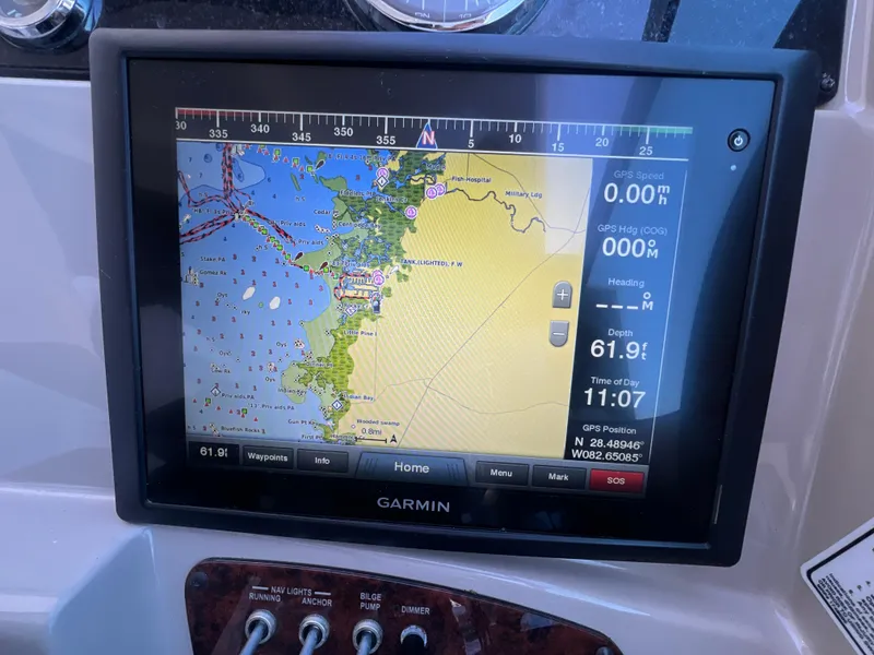 Slide: The Image of Garmin GPS display on 2006 Sea Ray 290 Sundancer, showing nautical map and navigation data. - 22
