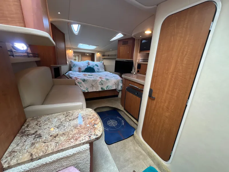 Slide: The Image of Interior of 2006 Sea Ray 290 Sundancer boat with cozy cabin and modern amenities. - 24