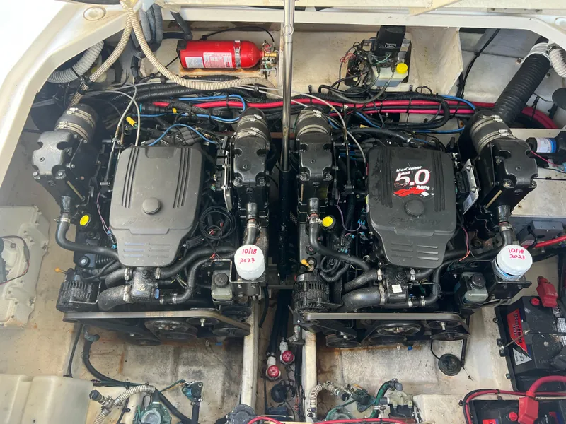 Slide: The Image of Twin engines in a 2006 Sea Ray 290 Sundancer boat engine compartment. - 32