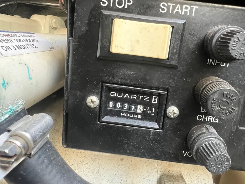 Slide: The Image of Control panel of a 2006 Sea Ray 290 Sundancer with hour meter reading 374 hours. - 34