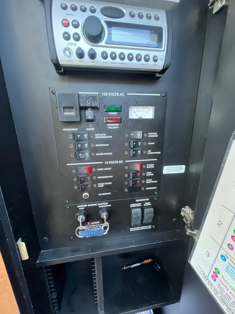 Slide: The Image of Electrical control panel of a 2006 Sea Ray 290 Sundancer boat. - 36