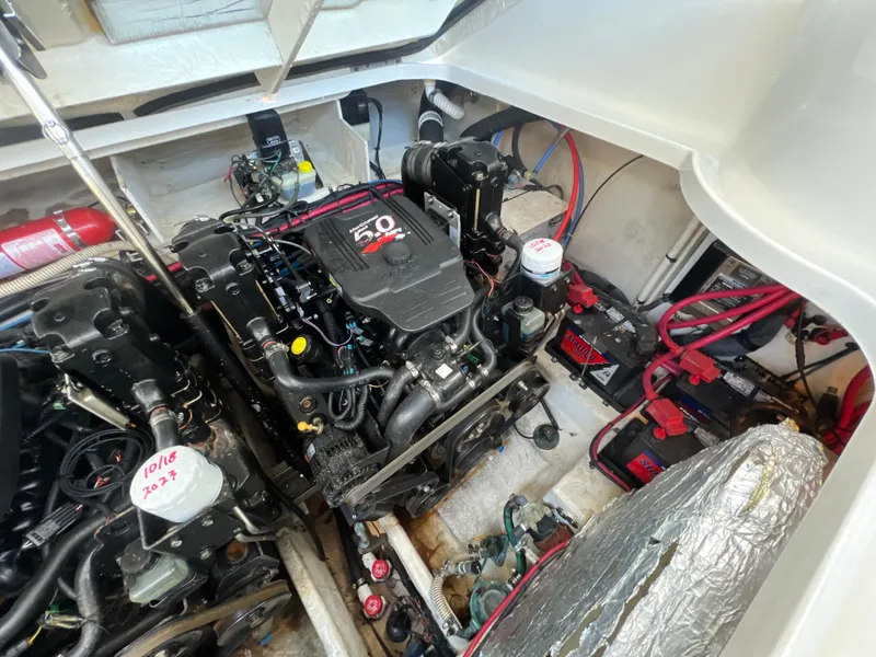 Slide: The Image of Engine compartment of a 2006 Sea Ray 290 Sundancer with visible components and wiring. - 39