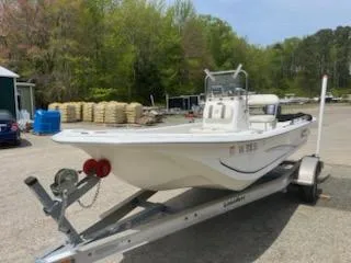 Slide: The Image of 2012 Carolina Skiff JVX18CC boat on trailer in outdoor setting. - 2