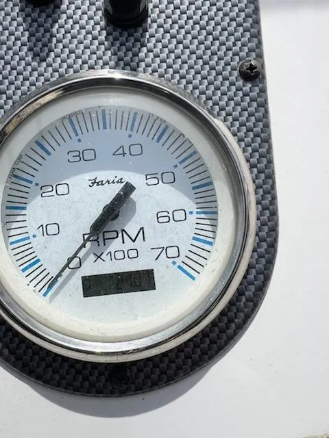 Slide: The Image of Close-up of a Faria RPM gauge on a 2012 Carolina Skiff JVX18CC boat. - 4