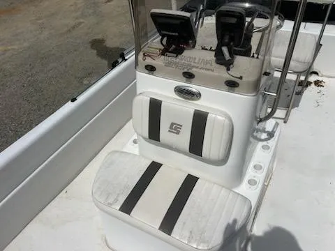 Slide: The Image of 2012 Carolina Skiff JVX18CC boat console with seating and navigation equipment. - 8