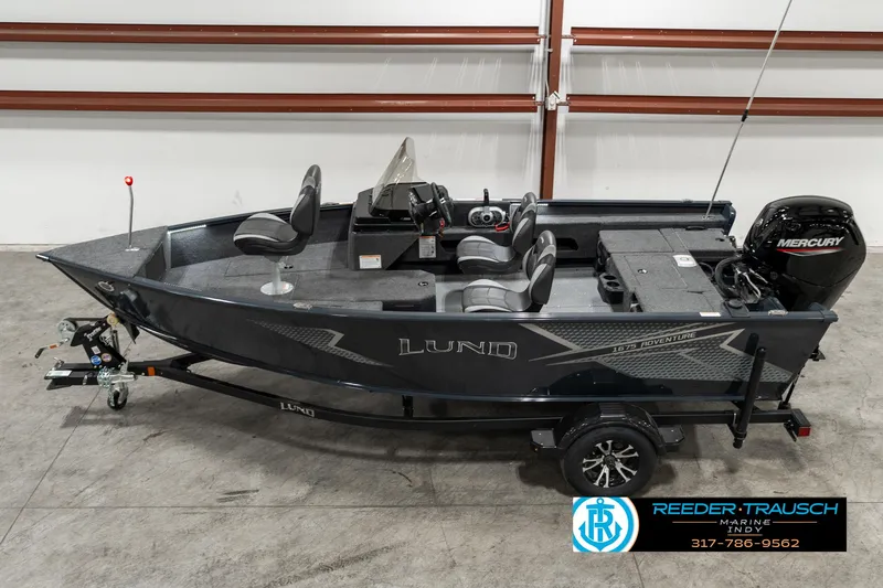 Slide: The Image of 2025 Lund 1675 Adventure SS boat with Mercury engine on trailer in showroom. - 1