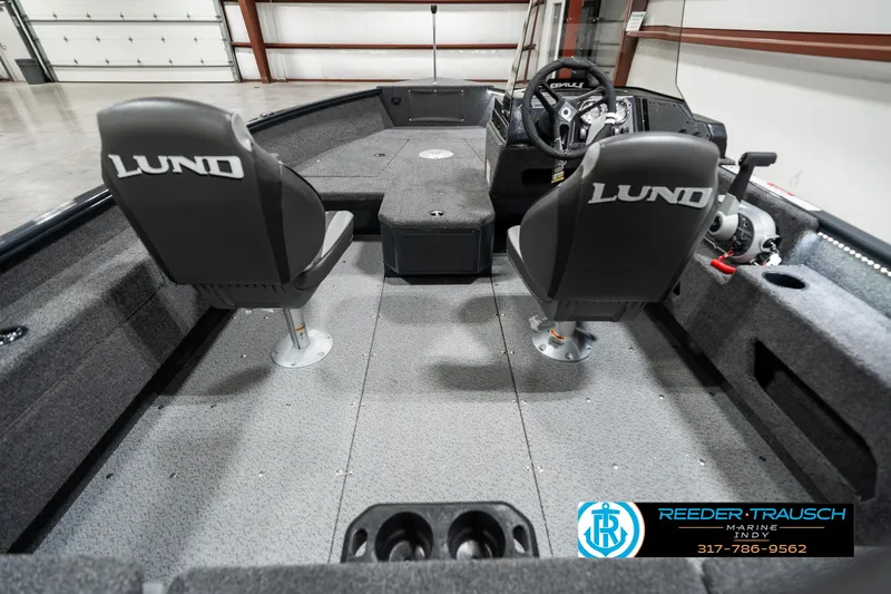 Slide: The Image of 2025 Lund 1675 Adventure SS boat interior with two seats and steering console. - 14