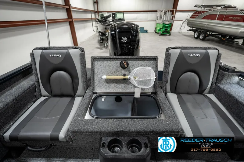 Slide: The Image of 2025 Lund 1675 Adventure SS boat interior with seating and fishing equipment. - 22