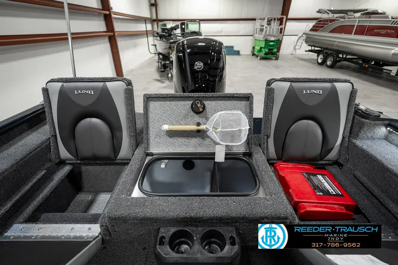 Slide: The Image of 2025 Lund 1675 Adventure SS boat interior with seating, storage, and fishing equipment. - 23