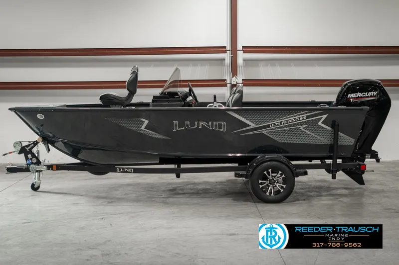 Slide: The Image of 2025 Lund 1675 Adventure SS boat with Mercury engine on trailer in showroom. - 3
