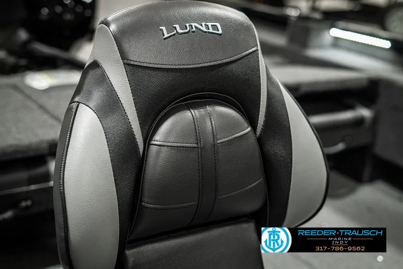 Slide: The Image of 2025 Lund 1675 Adventure SS boat seat, black and gray design, Reeder-Trausch logo visible. - 30
