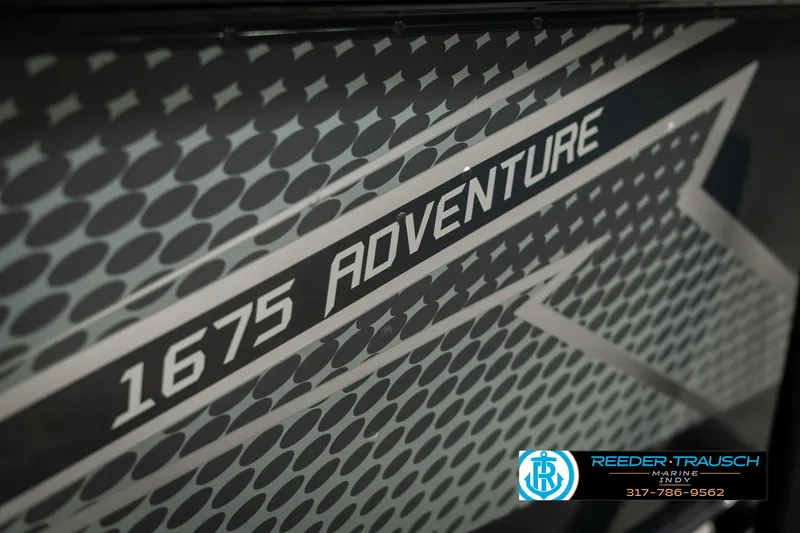 Slide: The Image of 2025 Lund 1675 Adventure SS boat graphic with Reeder-Trausch Marine logo. - 36