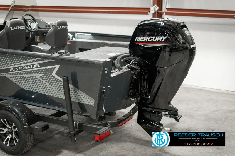 Slide: The Image of 2025 Lund 1675 Adventure SS boat with Mercury outboard motor in showroom. - 37