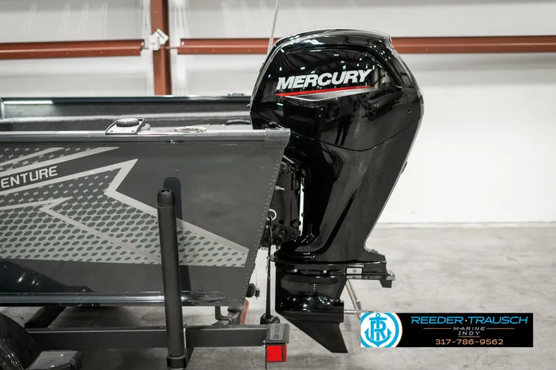 Slide: The Image of 2025 Lund 1675 Adventure SS boat with Mercury outboard motor in a showroom. - 38