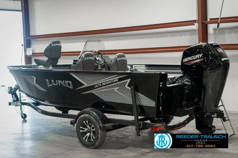 Slide: The Image of 2025 Lund 1675 Adventure SS boat with Mercury engine on trailer in showroom. - 4