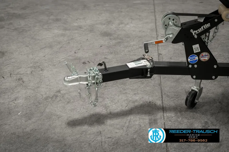 Slide: The Image of Trailer hitch of 2025 Lund 1675 Adventure SS boat, featuring safety chains and winch. - 42