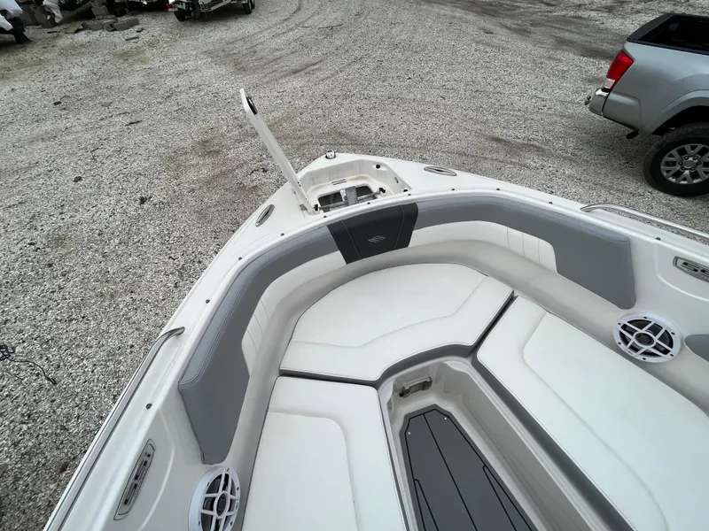Slide: The Image of 2023 Chaparral 23 SSIOB boat with spacious seating and sleek design. - 20