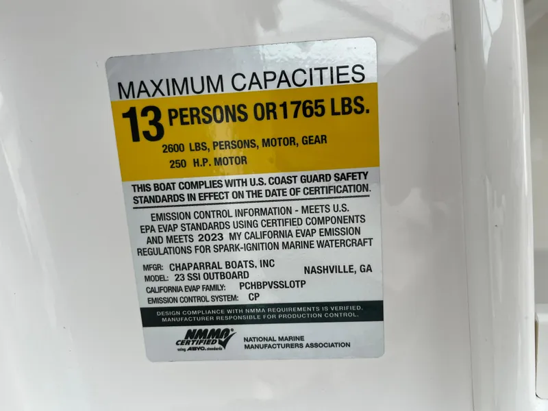 Slide: The Image of Capacity label on 2023 Chaparral 23 SSIOB boat, max 13 persons or 1765 lbs. - 23