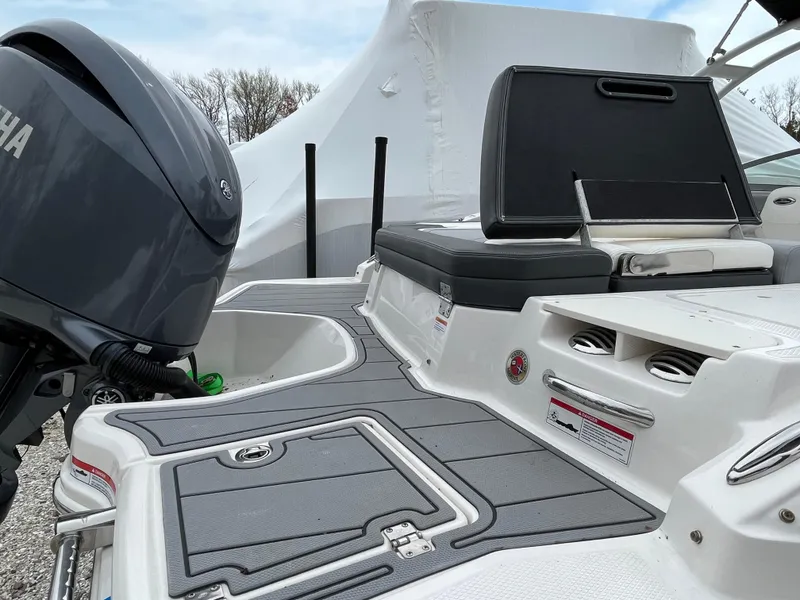 Slide: The Image of 2023 Chaparral 23 SSIOB boat with Yamaha engine, featuring sleek deck design. - 8