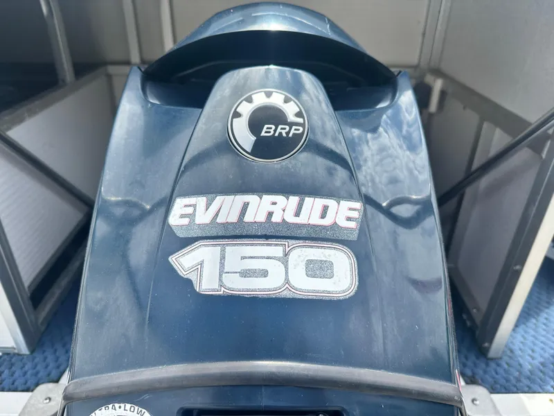 Slide: The Image of Evinrude 150 outboard motor on 2008 Manitou 24 Legacy boat. - 8